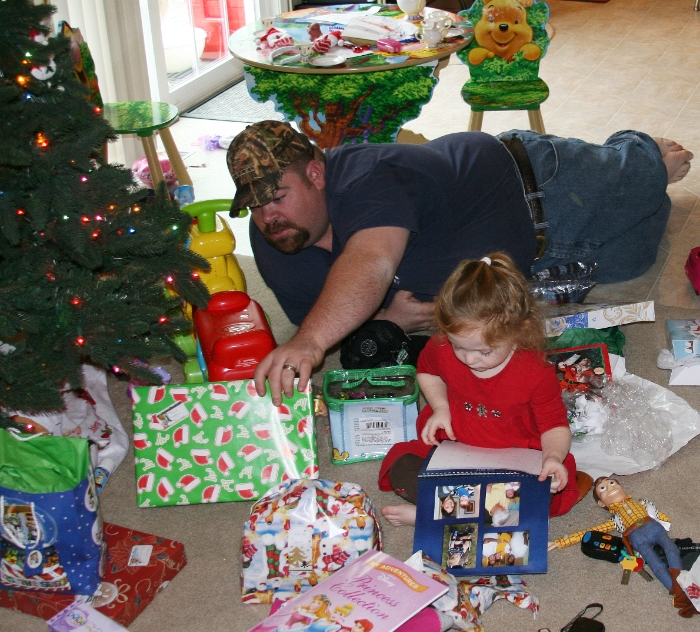 Dan reaches for a present